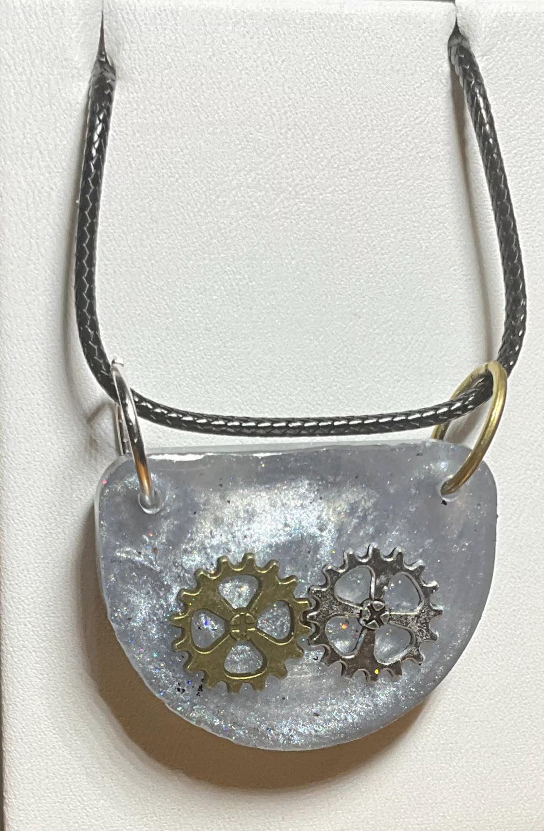 Necklace front with bronze gear and silver gear